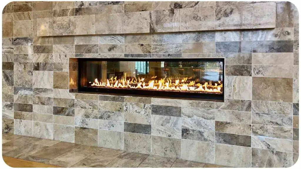 a fireplace in a modern home with stone walls