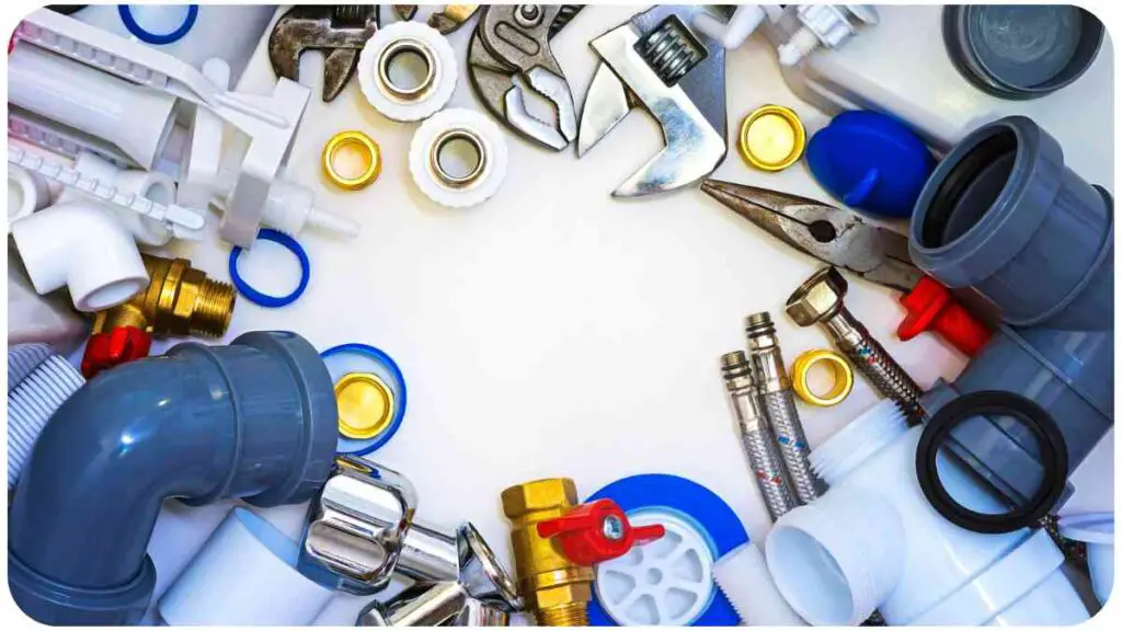 various plumbing tools arranged in a circle on a white surface