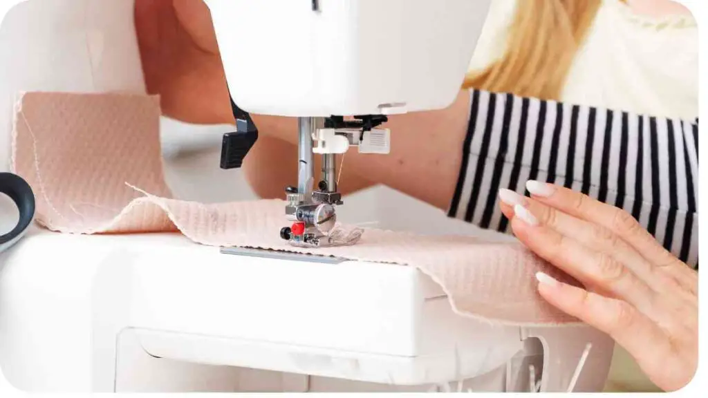 a person is using a sewing machine to make a piece of fabric