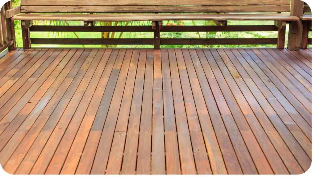 a wooden deck with a bench on it