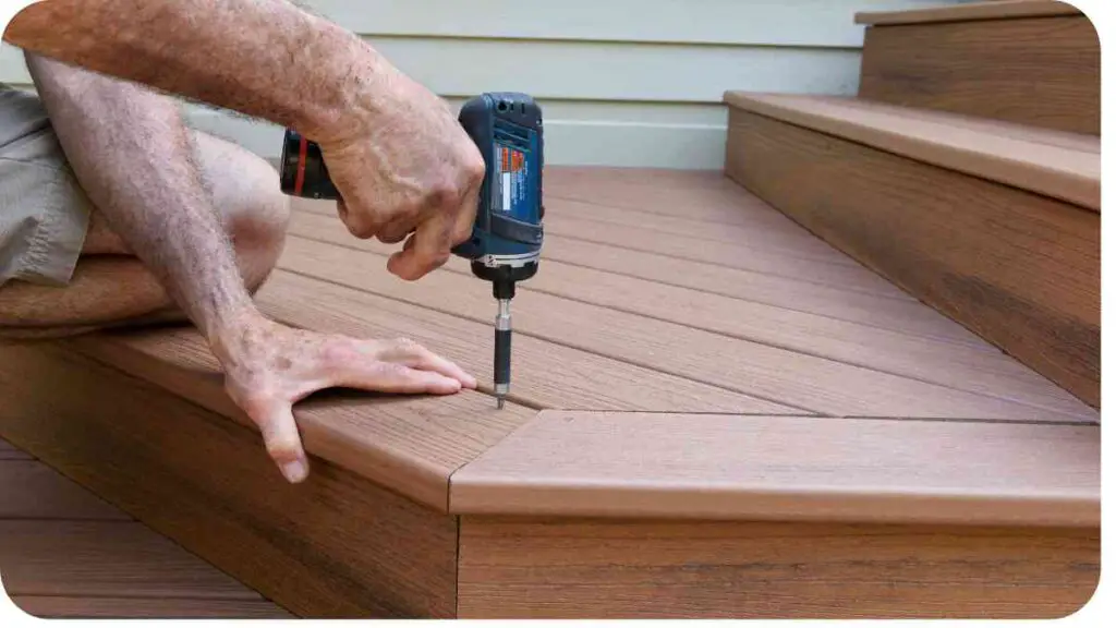 a person using an electric drill to install a wooden deck