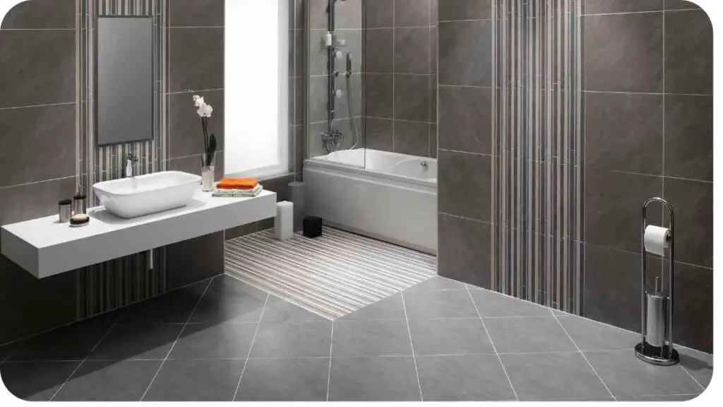 a modern bathroom with gray tile walls and flooring