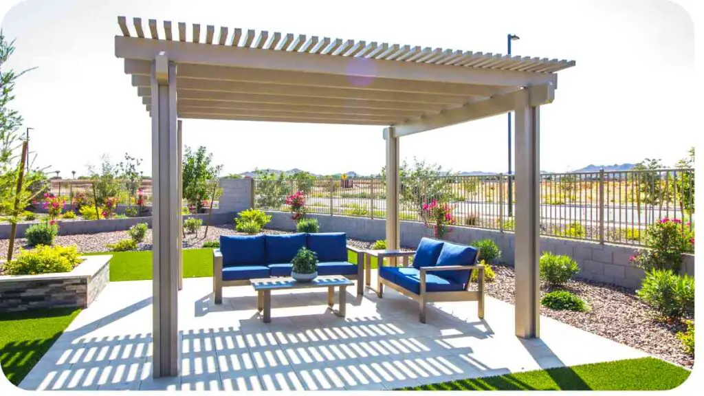 an outdoor patio with a gazebo and blue furniture