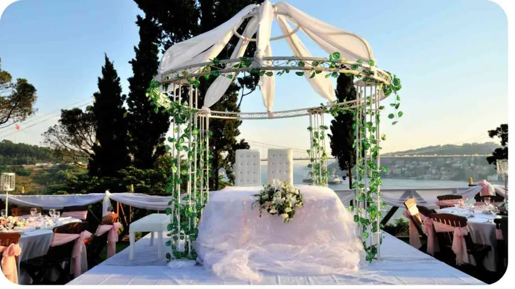 an outdoor wedding ceremony with a gazebo