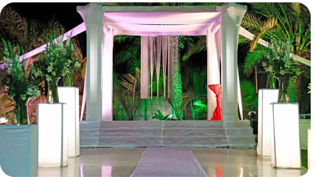 an outdoor wedding ceremony set up with white and green lights