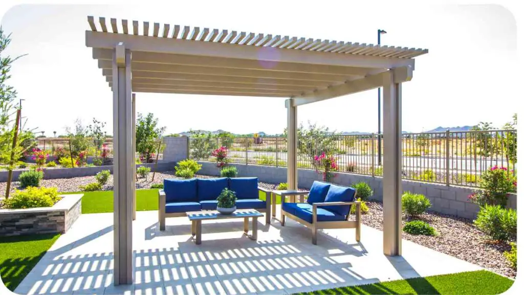 an outdoor patio with a gazebo and blue furniture