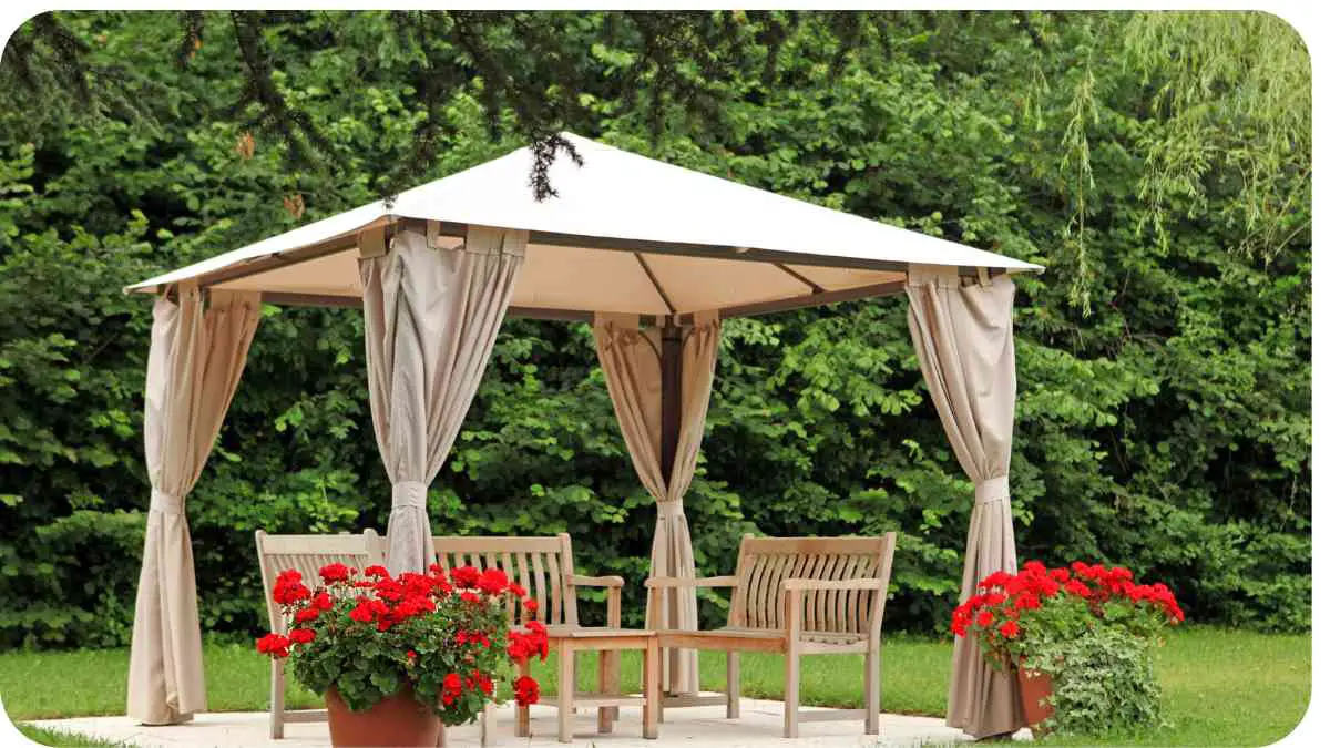 an outdoor gazebo with curtains on it