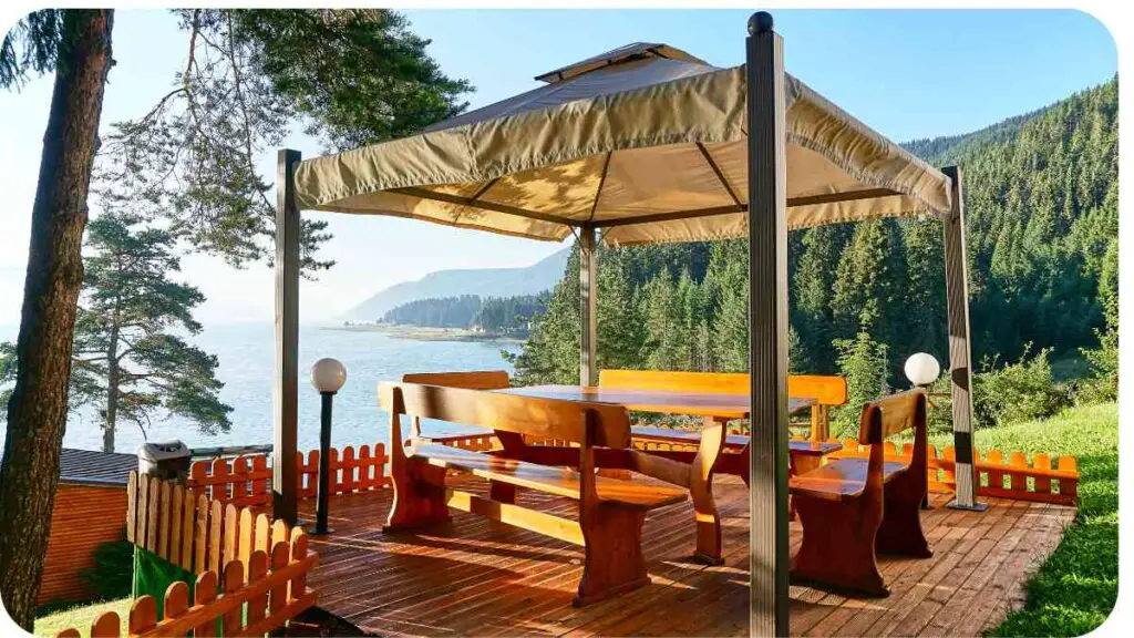 a gazebo on a wooden deck overlooking the lake