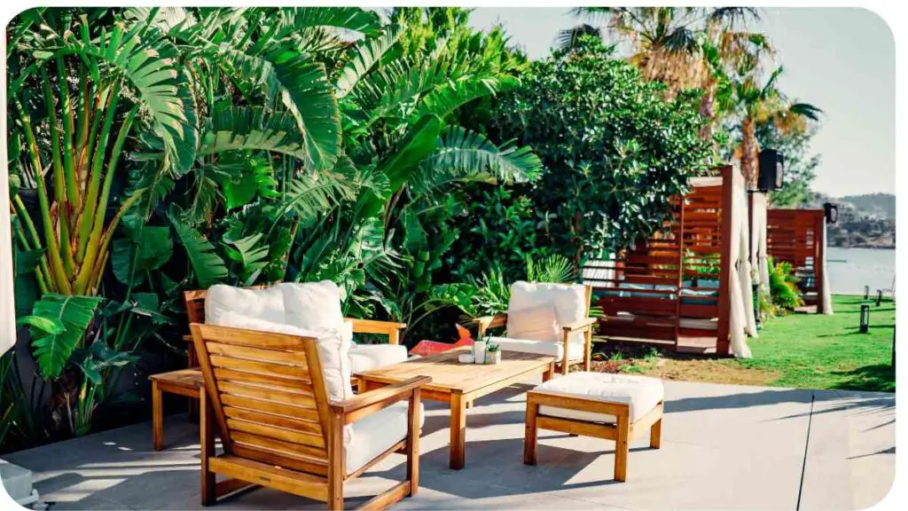 an outdoor patio with wooden furniture and palm trees