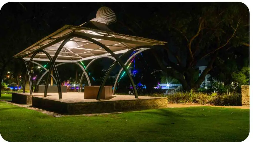 a gazebo in a park lit up at night