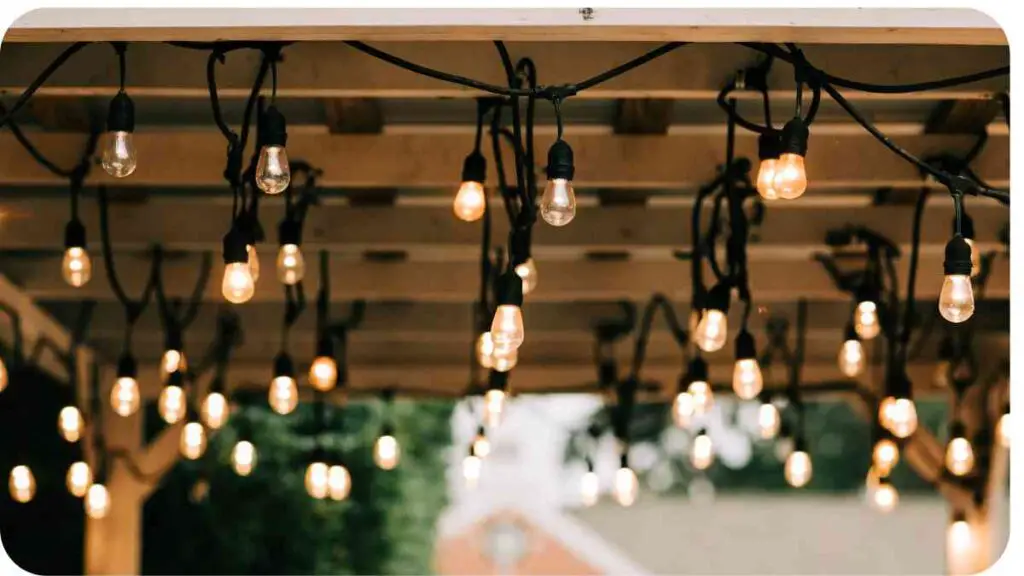 a gazebo with string lights hanging from it