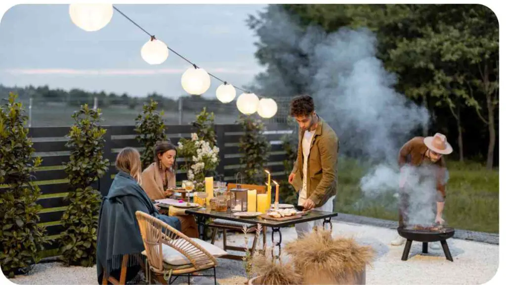 a group of people sitting around a table in an outdoor area