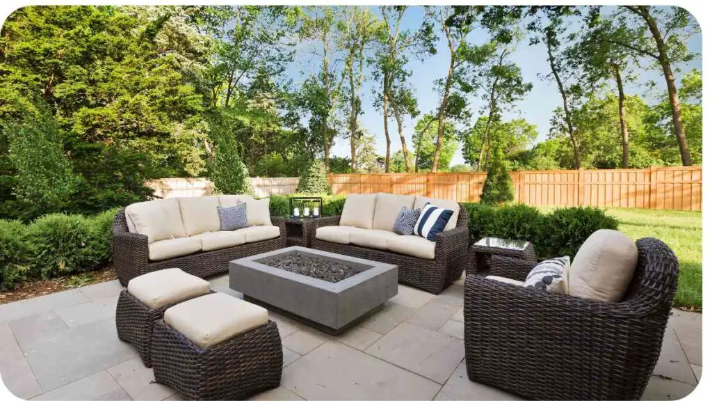 a patio with wicker furniture and a fire pit